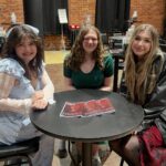Girls at table smiling